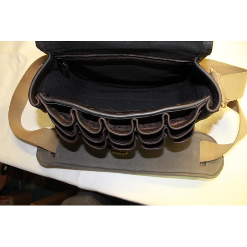 263 - Brown leather cartridge bag, black canvas interior with shoulder strap and 15 loop cartridge compart... 