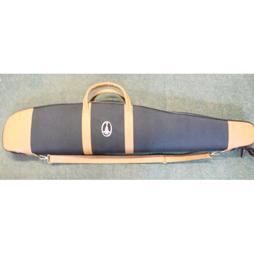 275 - Quality canvas and leather as new gun slip, with carrying handles and shoulder strap, foam interior