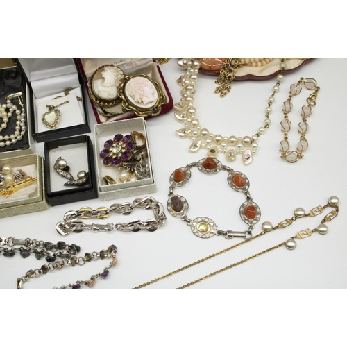31 - Collection of costume jewellery including an early C20th revolving cameo brooch, another similar bro... 