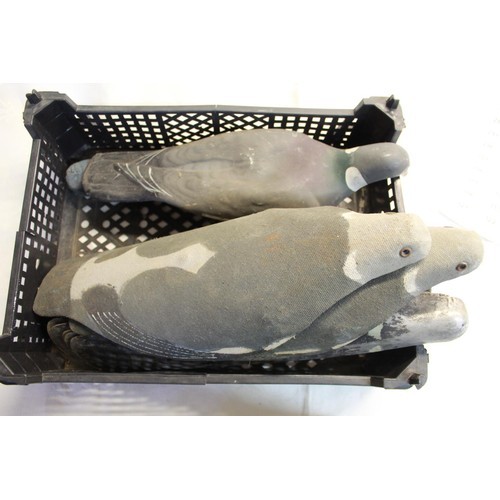 261 - Twelve pigeon decoys of aluminium, fibre glass, plastic, and canvas materials, with pegs (12)