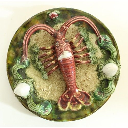 586 - Palissy style majolica lobster/crayfish plate together with a Majolica jug (jug H20cm)