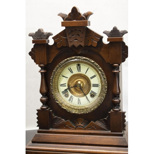 399 - Retailed by Fattorini & Sons' patent Automatic Alarm early C20th mahogany cased mantel clock, carved... 