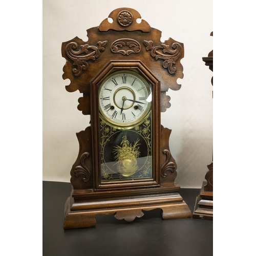 401 - Two late C19th New Haven Clock Co. mahogany cased shelf clocks, with carved cases, cream dials with ... 