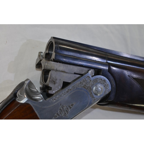 354 - A Webley & Scott 12 gauge O/U double barreled shot gun. Serial No W00120. Barrell length 30'. Overal... 