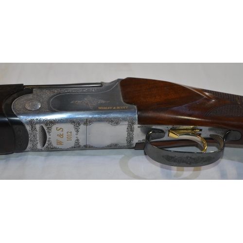 354 - A Webley & Scott 12 gauge O/U double barreled shot gun. Serial No W00120. Barrell length 30'. Overal... 