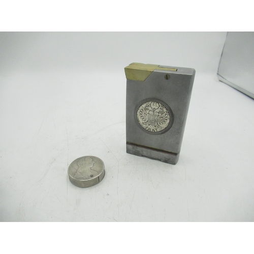 77 - Large metal lighter with Maria Theresa coin encased and a circular Maria Theresa coin lighter (2)