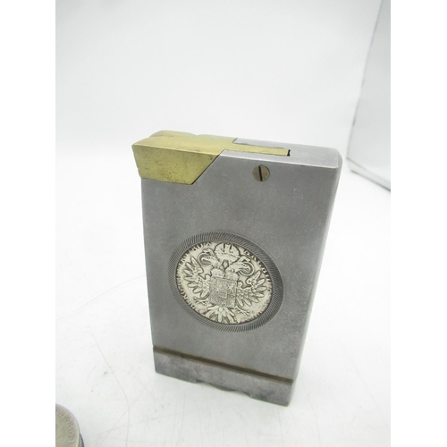 77 - Large metal lighter with Maria Theresa coin encased and a circular Maria Theresa coin lighter (2)