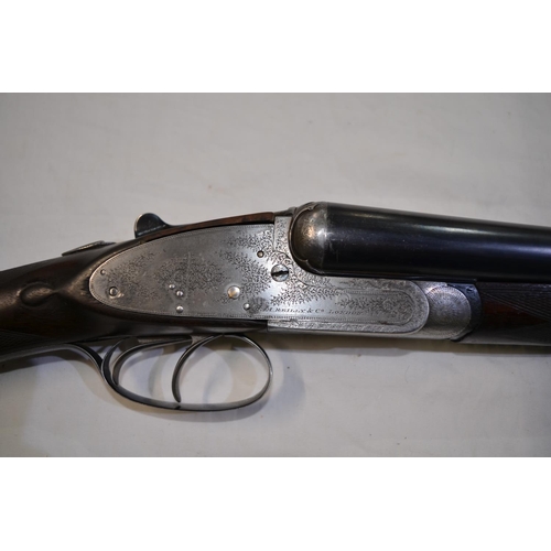 381 - An E.M. Reilly & Co 12 gauge box lock side by side double barrel shot gun. Double trigger, ejector. ... 