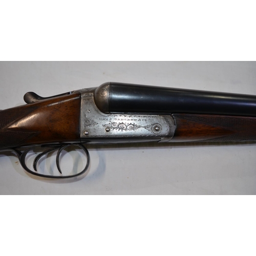 390 - A Chas Osbourne 12 gauge box lock side by side double barrel shot gun. Double trigger, non ejector. ... 