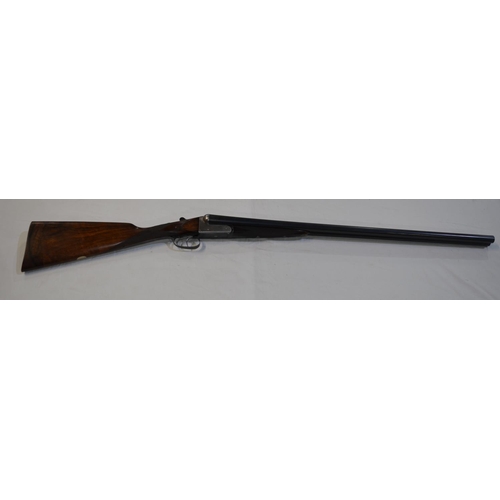 391 - A Churchill 12 gauge box lock side by side double barrel shot gun. Double trigger with ejector. Seri... 