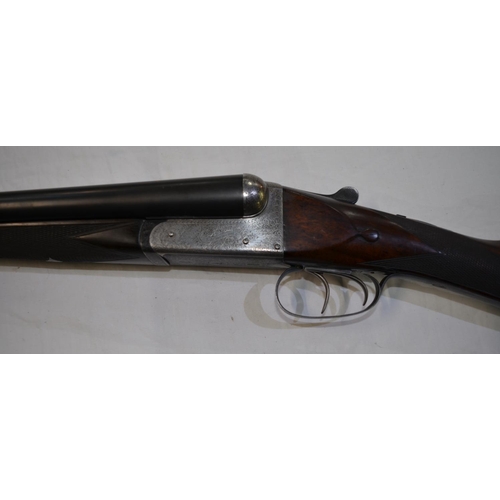 391 - A Churchill 12 gauge box lock side by side double barrel shot gun. Double trigger with ejector. Seri... 