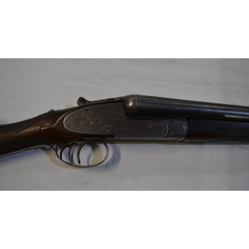 392 - A Laurona 12 gauge side lock side by side double barrel shot gun. Double trigger with ejector. Seria... 