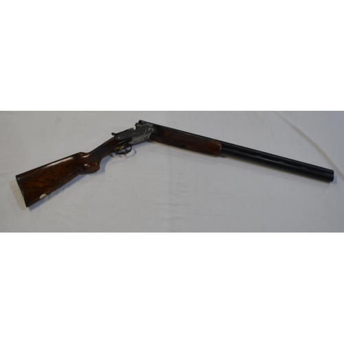 432 - A cased Beretta Sporting 687 EELL 12 gauge over/under double barrel shot gun with chokes. Single tri... 