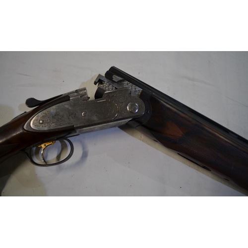 432 - A cased Beretta Sporting 687 EELL 12 gauge over/under double barrel shot gun with chokes. Single tri... 