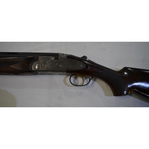 432 - A cased Beretta Sporting 687 EELL 12 gauge over/under double barrel shot gun with chokes. Single tri... 