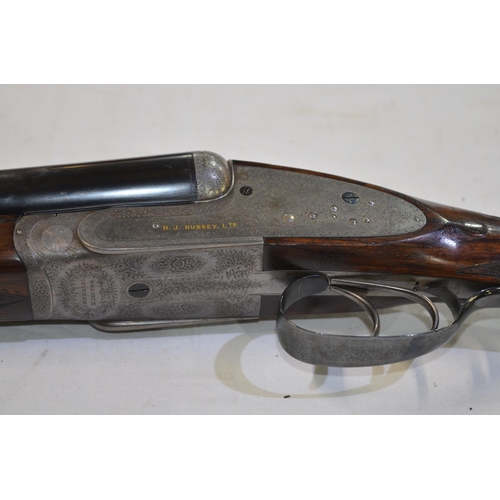 433 - A cased H.J.Hussey side lock 12 gauge side by side double barrel shot gun. Double trigger with eject... 