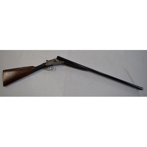 433 - A cased H.J.Hussey side lock 12 gauge side by side double barrel shot gun. Double trigger with eject... 