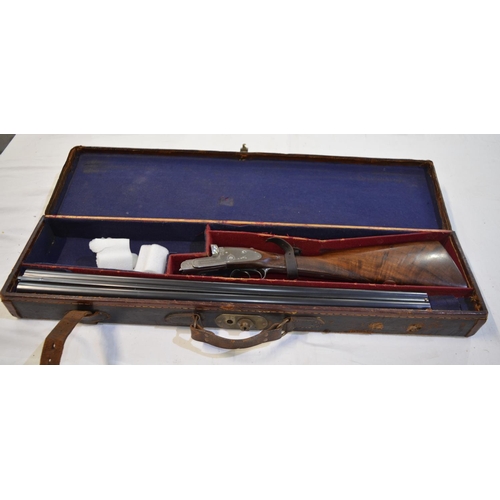 434 - A cased Thomas Bland side lock 12 gauge side by side double barrel shot gun. Double trigger with eje... 