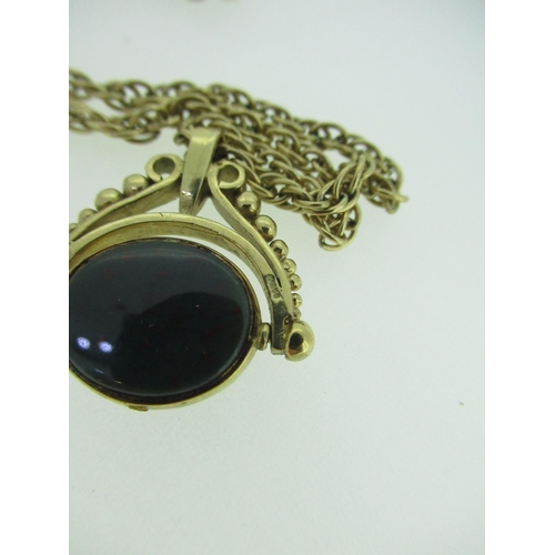 45 - 9ct yellow gold revolving pendant set with bloodstone and moss agate, stamped 375, on a 9ct yellow g... 