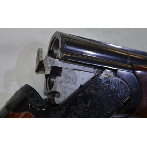 327 - A Franchi 12g O/U shotgun with single trigger and ejectors, 28' barrel, overall length 44.5'. Serial... 