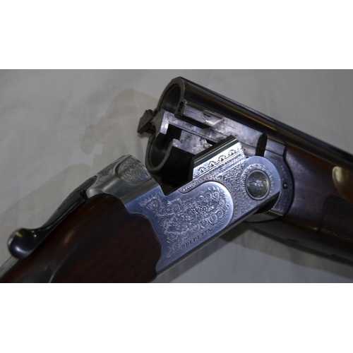 328 - A Beretta 12G single trigger O/U with ejectors, serial number E86337B. 28'barrel, overall 45.5'. Sho... 