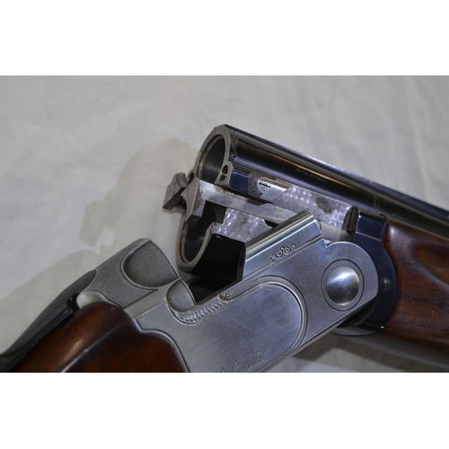 329 - A Beretta model 682 12 gauge O/U double barreled shot gun. Serial E43794B. Barrell length 28'. Overa... 