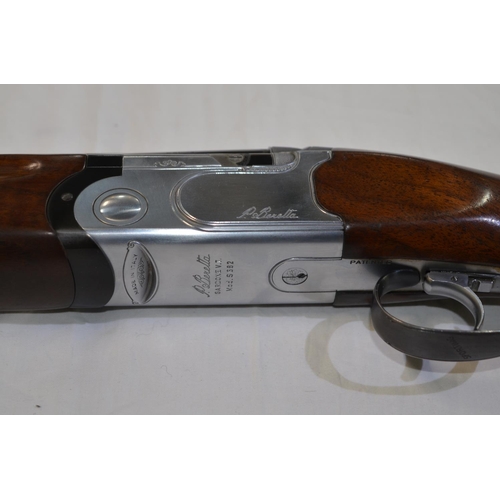 329 - A Beretta model 682 12 gauge O/U double barreled shot gun. Serial E43794B. Barrell length 28'. Overa... 