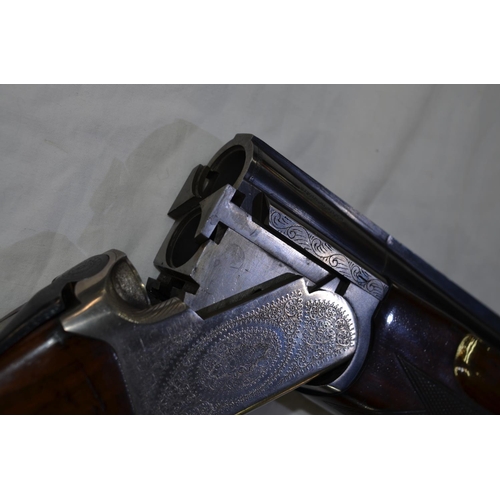 331 - An engraved Lanber 12 gauge O/U double barrelled shot gun. Serial No 178033. Barrell length 27.5'. O... 