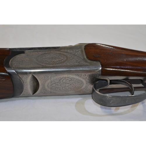 331 - An engraved Lanber 12 gauge O/U double barrelled shot gun. Serial No 178033. Barrell length 27.5'. O... 