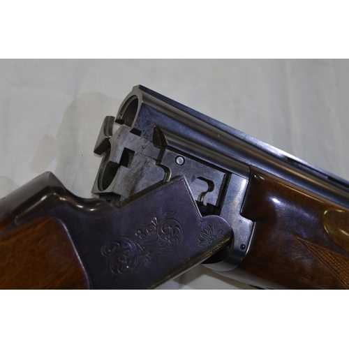 333 - A Miroku 12 gauge O/U double barrelled shot gun. Serial No 725544. Barrell length 26'. Overall 44.5'... 