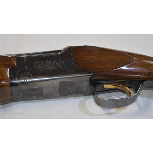 333 - A Miroku 12 gauge O/U double barrelled shot gun. Serial No 725544. Barrell length 26'. Overall 44.5'... 