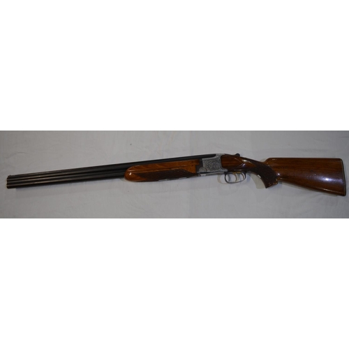 337 - A Laurona 12g O/U double barrelled shot gun. Serial No 129669. Barrell length 28'. Overall 44.5'.
Do... 