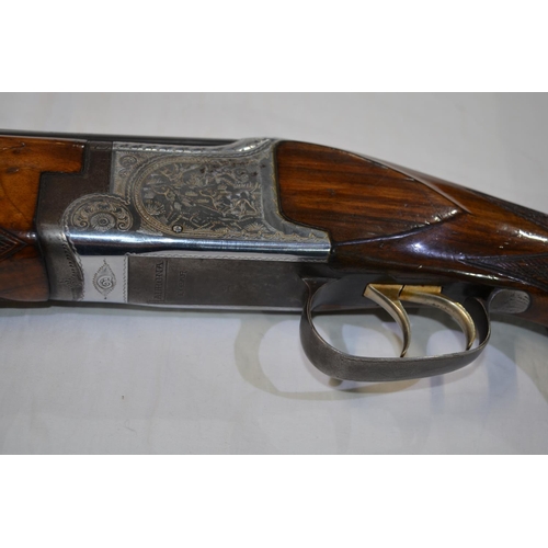 337 - A Laurona 12g O/U double barrelled shot gun. Serial No 129669. Barrell length 28'. Overall 44.5'.
Do... 