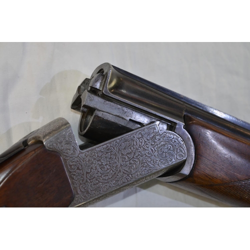 338 - A Hilton Century 12 gauge O/U double barrelled shot gun. Serial No 9821. Barrell length 27'. Overall... 