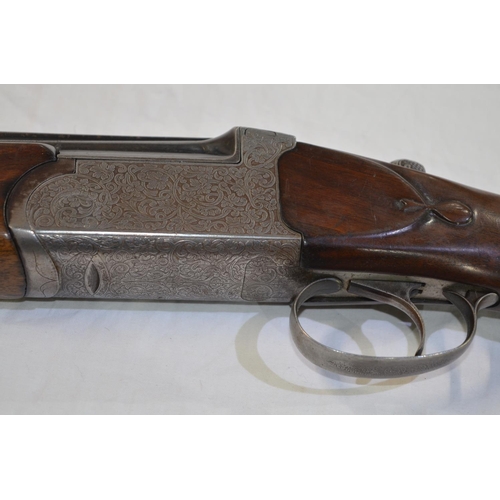 338 - A Hilton Century 12 gauge O/U double barrelled shot gun. Serial No 9821. Barrell length 27'. Overall... 