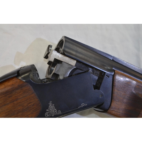 340 - A Baikal 20 gauge O/U double barrelled shot gun. Serial No 022704939B. Barrell length 28'. Overall 4... 