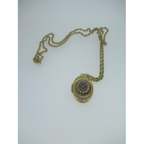 51 - 9ct yellow gold locket set with seed pearls and pale blue stone, stamped 375, on a 9ct gold chain, s... 