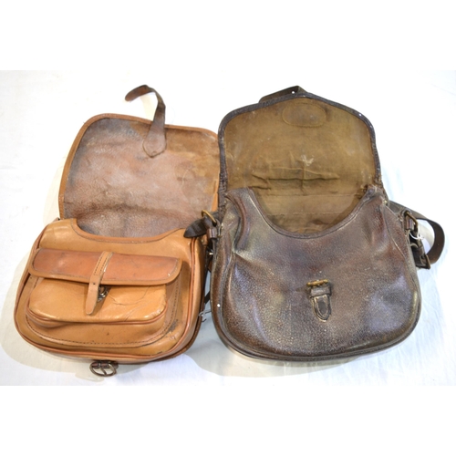 238B - A pair of vintage leather cartridge bags.