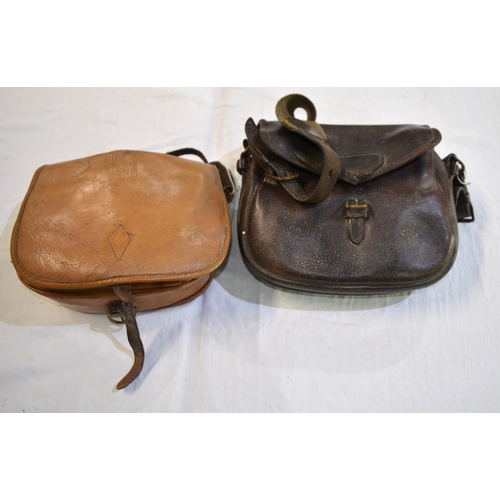 238B - A pair of vintage leather cartridge bags.