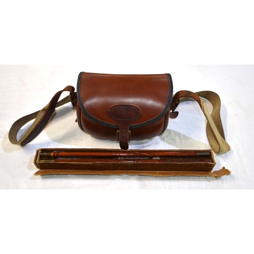 238C - A leather cartridge bag with leather and canvas shoulder strap and a boxed 12 bore cleaning kit.