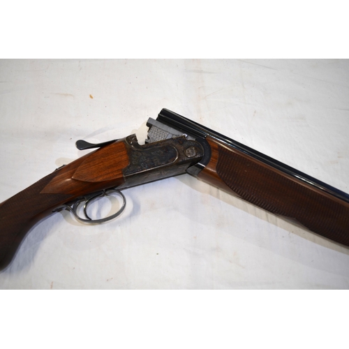 446 - A John McNab Highlander 20 gauge over under double barrelled shotgun with fleece lined brown leather... 