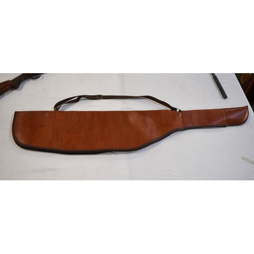 446 - A John McNab Highlander 20 gauge over under double barrelled shotgun with fleece lined brown leather... 