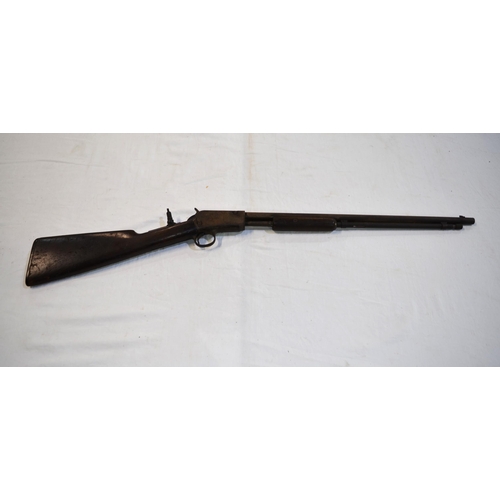 505 - A rare Winchester .22 rim fire pump action rifle, circa 1890 with additional rear sight. Section 1 l... 