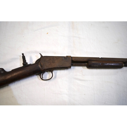 505 - A rare Winchester .22 rim fire pump action rifle, circa 1890 with additional rear sight. Section 1 l... 