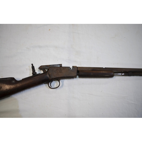 505 - A rare Winchester .22 rim fire pump action rifle, circa 1890 with additional rear sight. Section 1 l... 