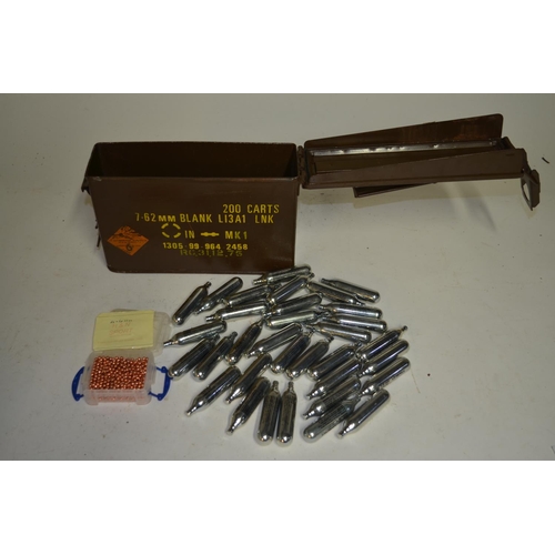 128B - A collection of 12g CO2 capsules for air guns, an ammunition box for 7.62 blank rounds and a small b... 