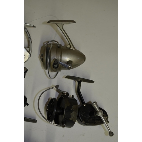 61 - Collection of seven vintage spinning reels including J.W. Young & Sons Ambidex casting reel, Mitchel... 