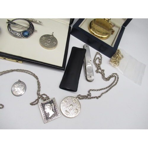 58 - Two hallmarked sterling silver pendants, both stamped 1977, Sheffield, one on white metal chain, a h... 