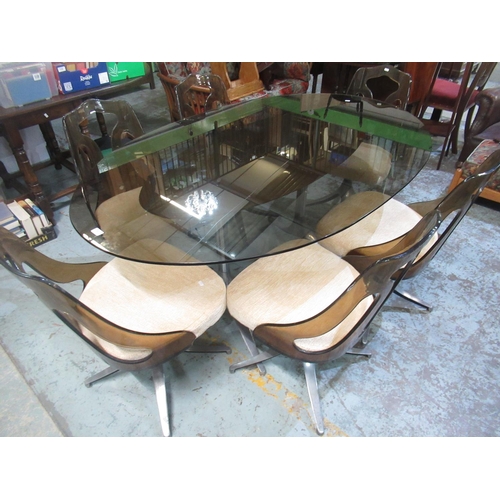 700 - Retro Late 1960s/early 1970s dining table set with smoky glass oval top supported on twin chrome org... 