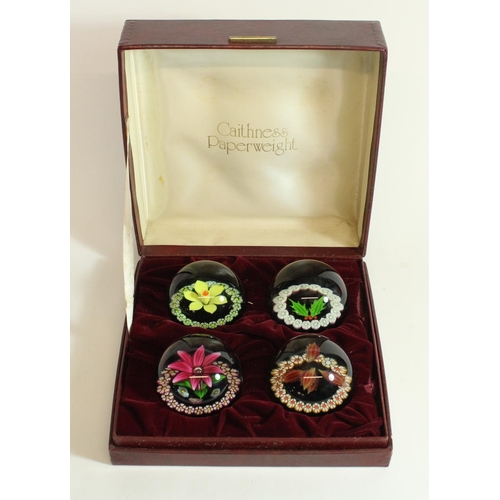 615 - Set of four Caithness millefiori and lampwork glass paperweights of the four Seasons, Spring through... 